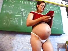 Pegnant teacher masturbates in her desk